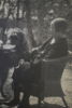 HENRY B. GOODWIN (1878–1931), tillskriven. Ida B. Goodwin med familjens airedaleterrier vid kaffebordet, sannolikt 1920-tal.